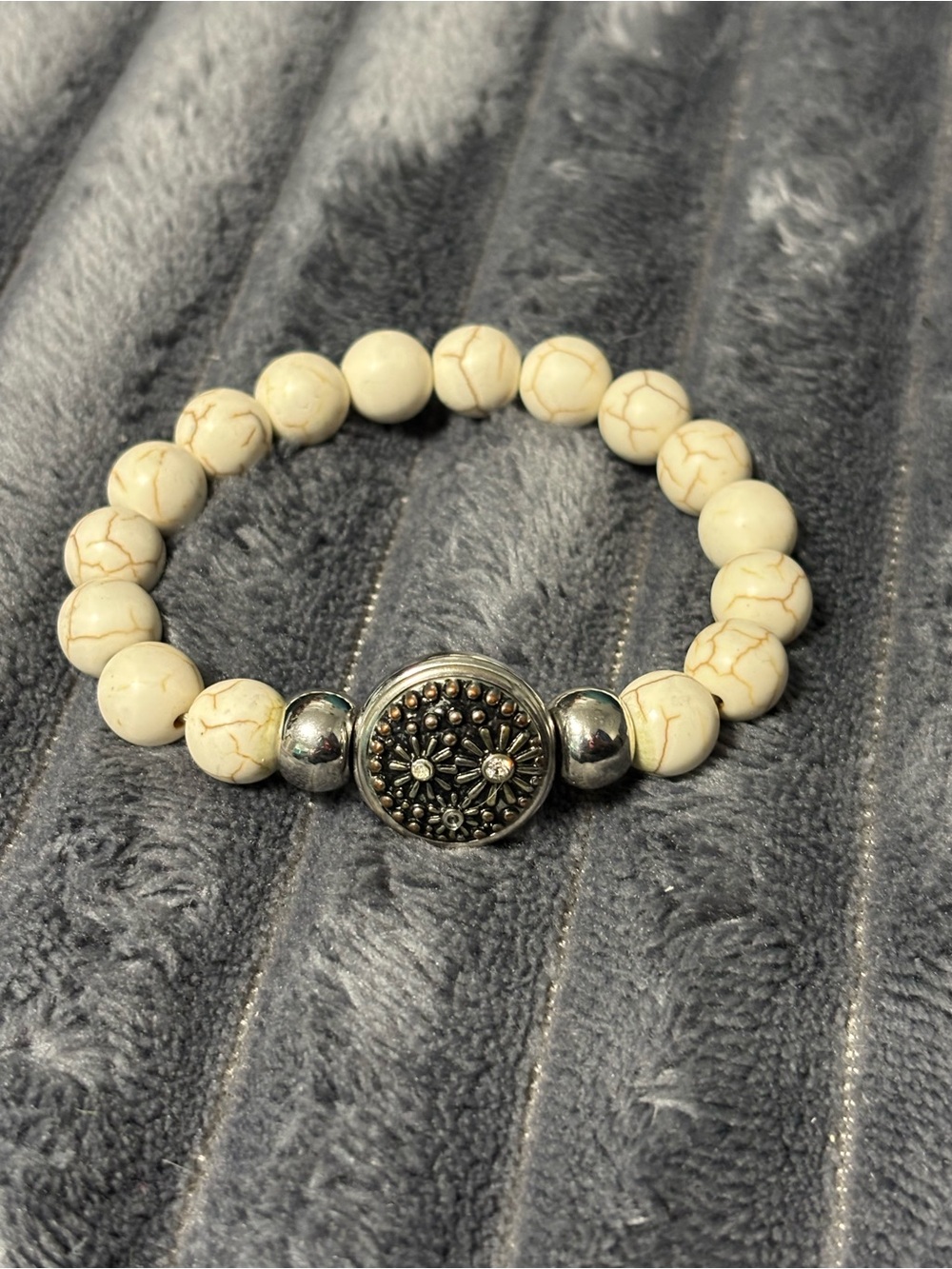 Cream Beaded Stretch Bracelet with Decorative Silver Medallion